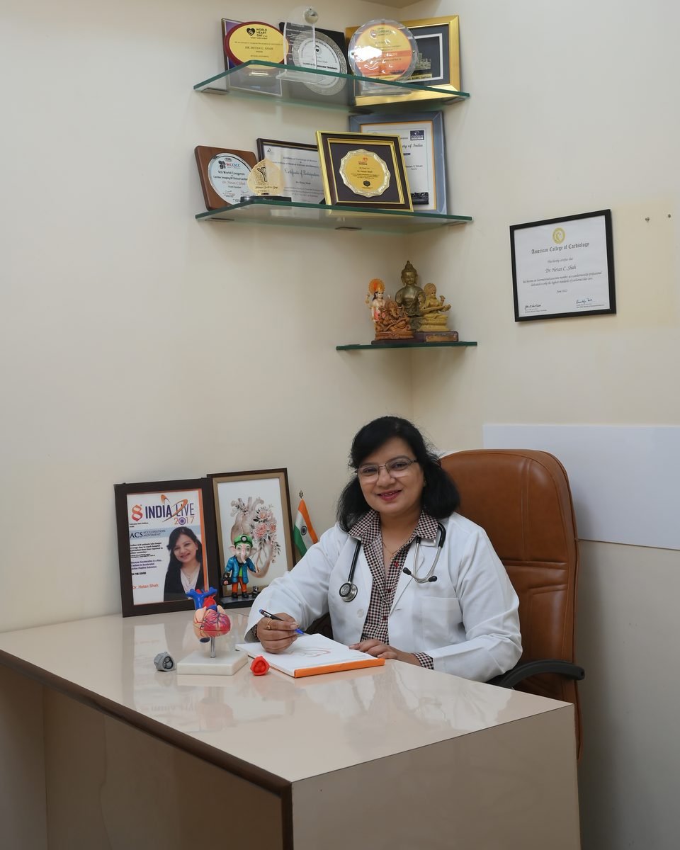 Dr. Hetan Shah at her desk in the clinic