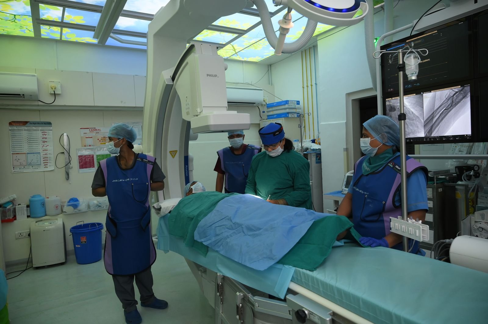 Cardiac catheterisation lab team preparing a patient for a procedure